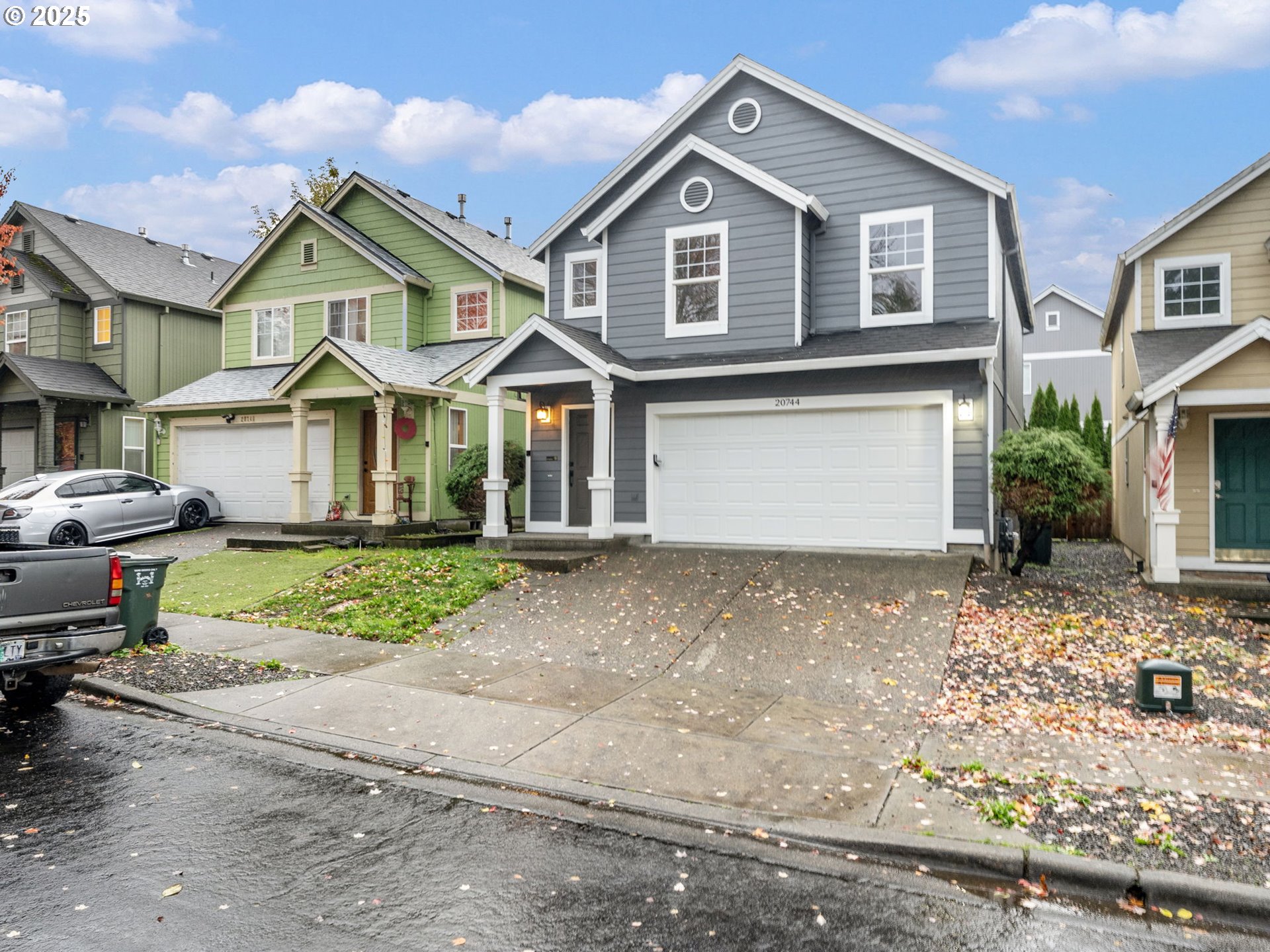 20744 Southwest Bingo Lane Beaverton, OR 97006 - Photo 3 of 26 a front view of a house with a yard and garage