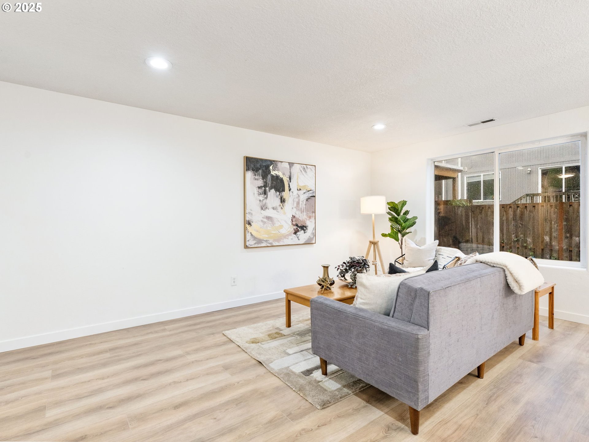 20744 Southwest Bingo Lane Beaverton, OR 97006 - Photo 5 of 26 a living room with furniture and a large window