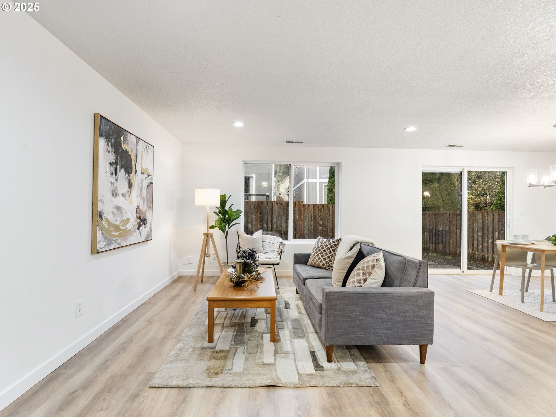 20744 Southwest Bingo Lane Beaverton, OR 97006 - Photo 6 of 26 a living room with furniture and a table with wooden floor