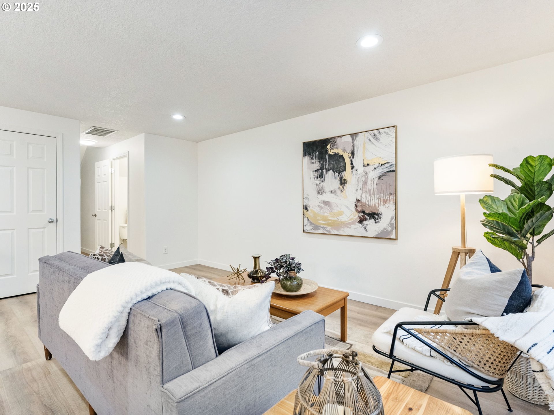 20744 Southwest Bingo Lane Beaverton, OR 97006 - Photo 7 of 26 a spacious bedroom with a bed and a couch