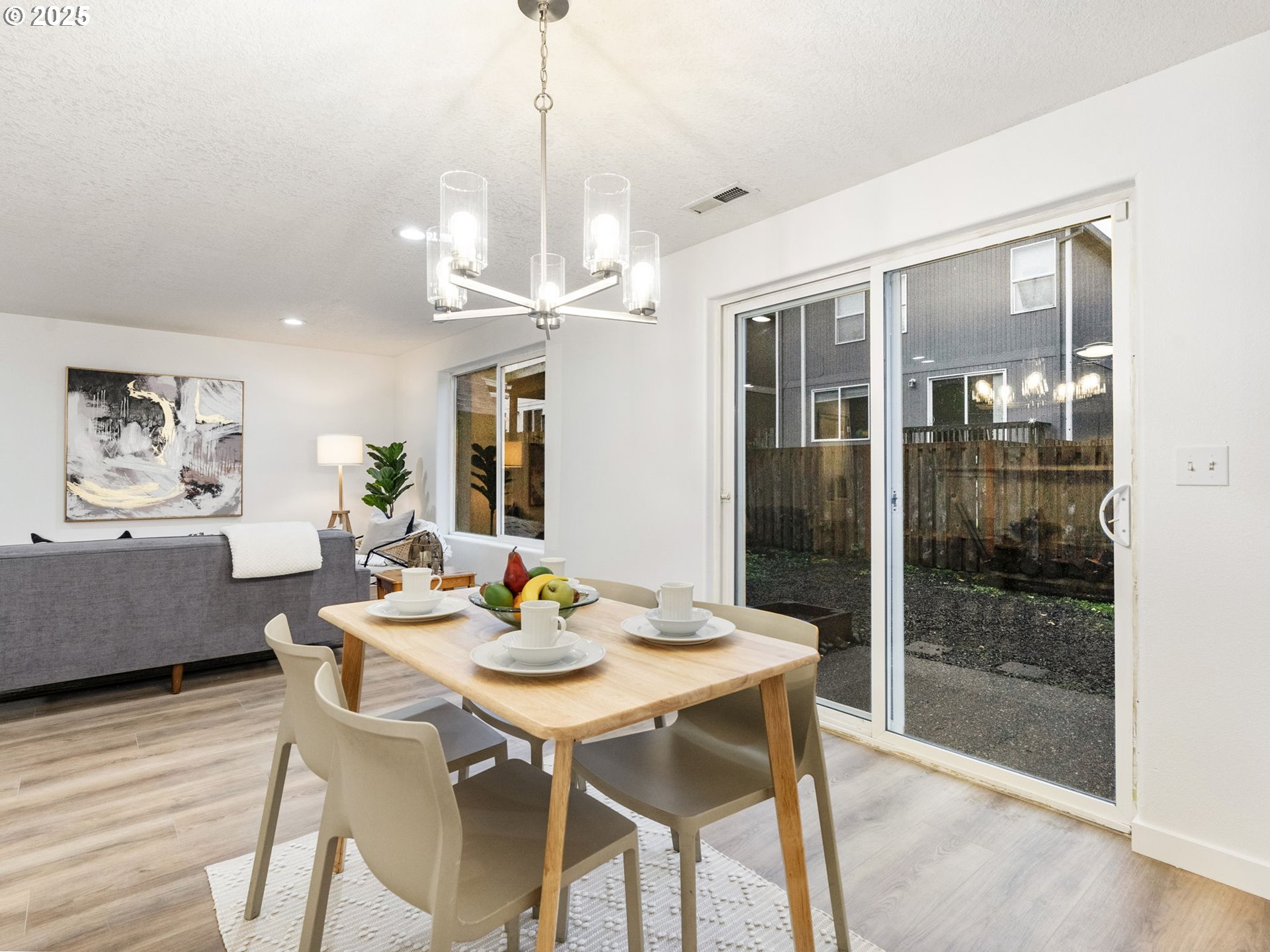 20744 Southwest Bingo Lane Beaverton, OR 97006 - Photo 8 of 26 a view of a dining room with furniture window and wooden floor