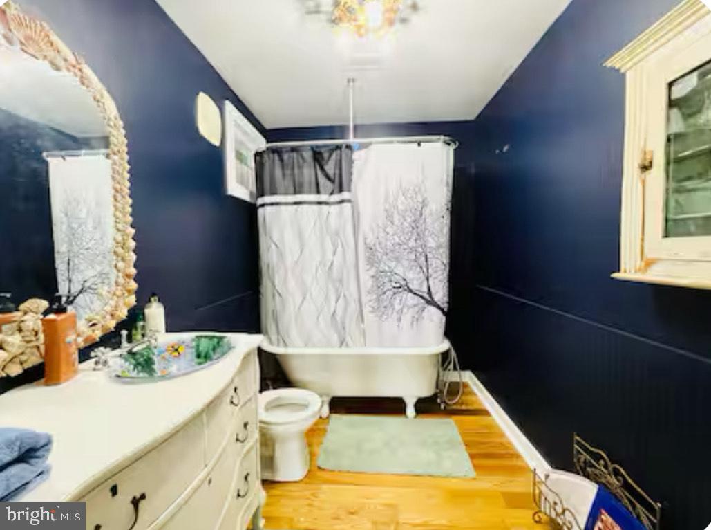 820 Bay Front Avenue North Beach, MD 20714 - Photo 14 of 19 a bathroom with a sink and a mirror