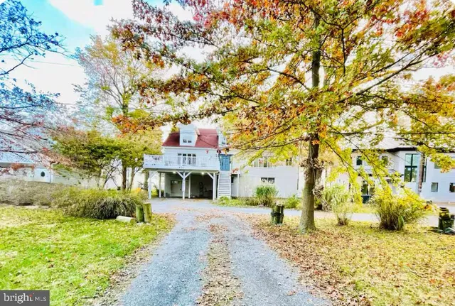 a view of house with yard