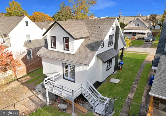 a aerial view of a house with a yard
