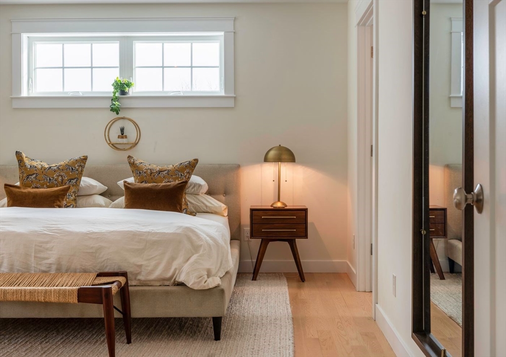 5 John West Road Exeter, NH 03833 - Photo 13 of 33 a bedroom with a bed and a window