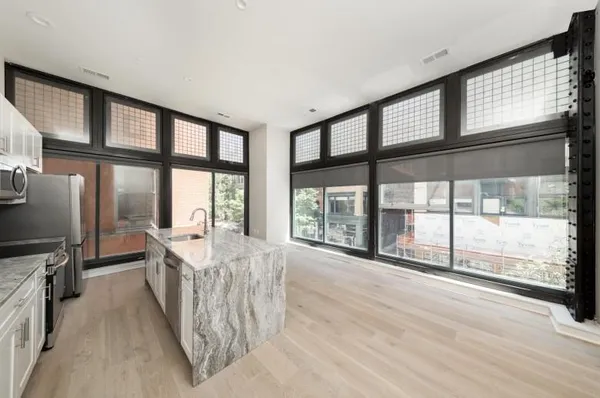 a bathroom with a shower and a toilet