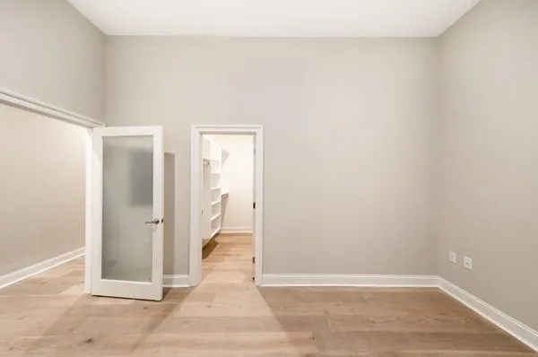 a view of wooden floor in an empty room