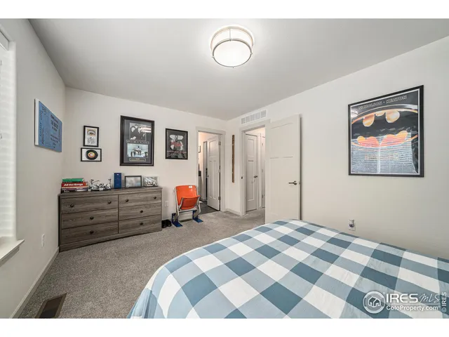 a bedroom with furniture and window