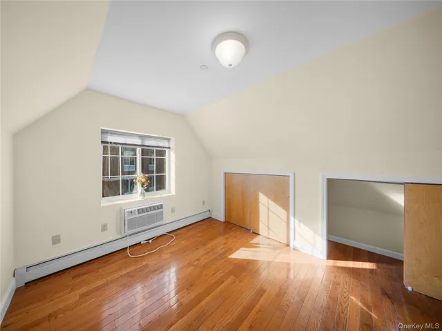 a dining room with furniture and a window