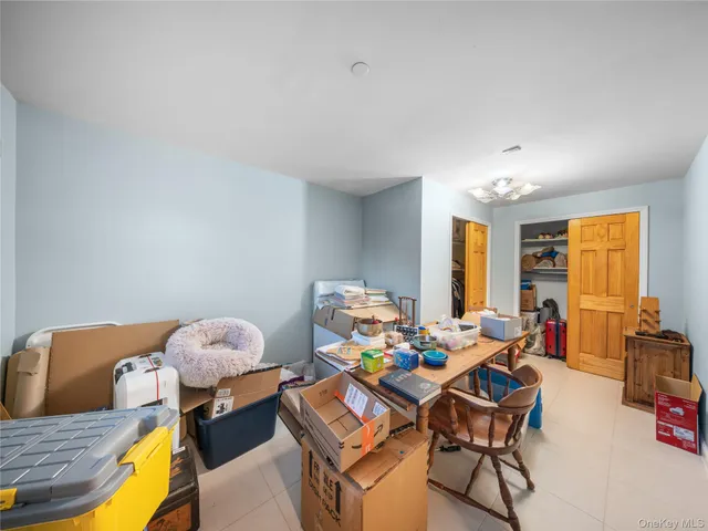 a view of a livingroom with furniture and a flat screen tv