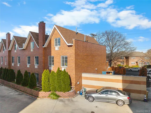a view of a car parked in front of a house