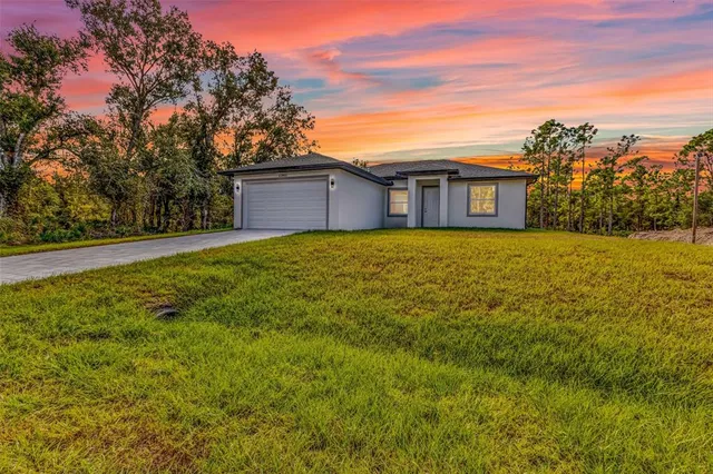 a house with yard in front of it