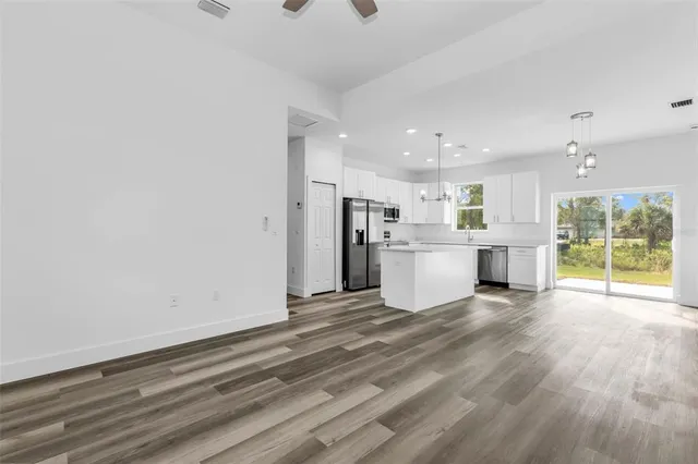 a view of a kitchen with a sink and a stove top oven