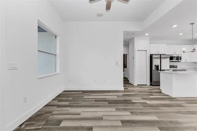 a view of kitchen refrigerator and microwave