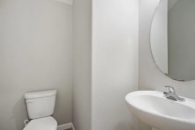 a view of kitchen with stainless steel appliances granite countertop refrigerator stove microwave and cabinets