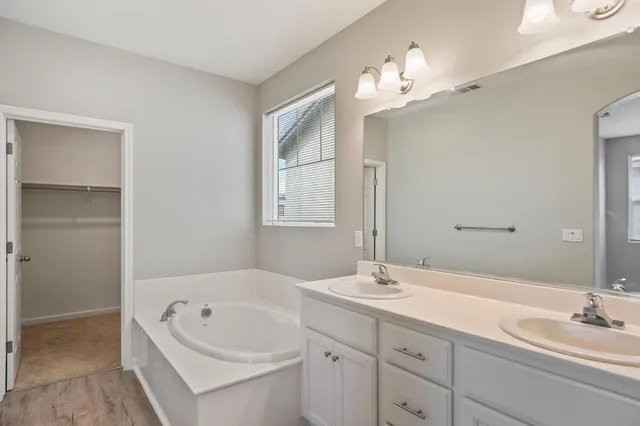 a bathroom with a glass shower door