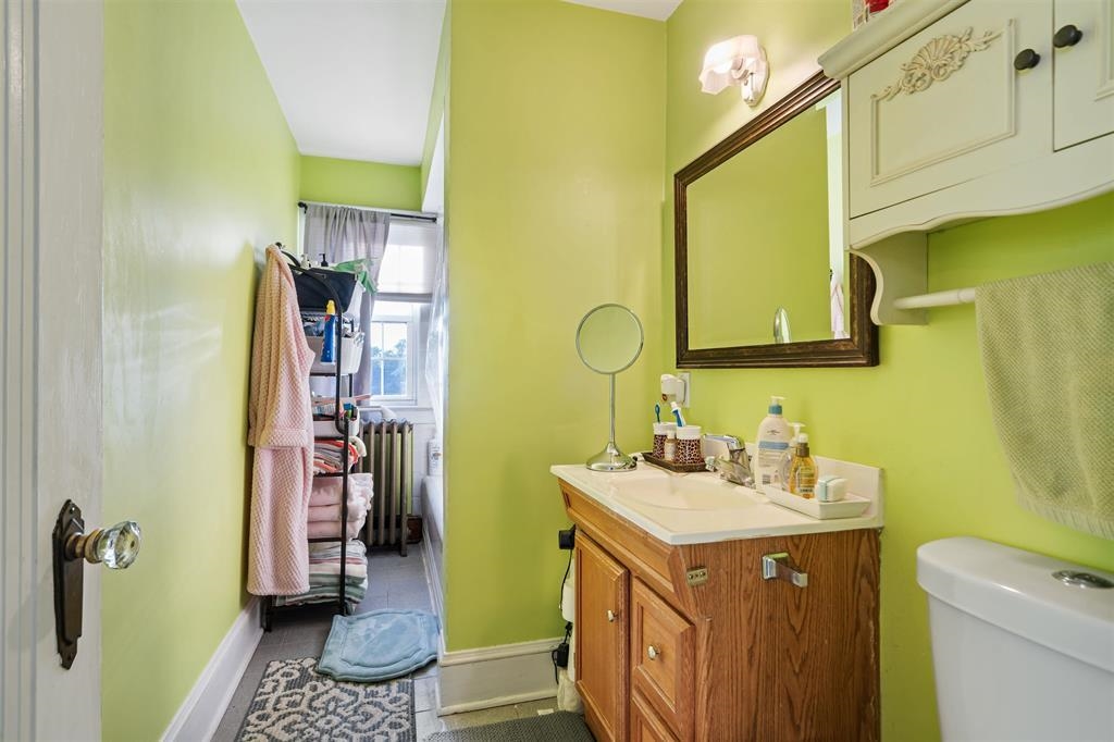 1041 Stonewall Lane, Unit 2 Secaucus, NJ 07094 - Photo 4 of 8 a bathroom with a sink toilet and shower