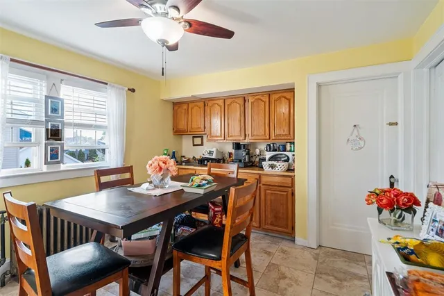 a view of a dining room with furniture and window