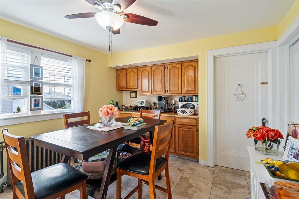 1041 Stonewall Lane, Unit 2 Secaucus, NJ 07094 - Photo 7 of 8 a view of a dining room with furniture and window