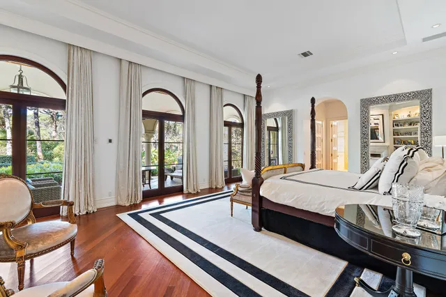 a bed room with a bed and a night stand