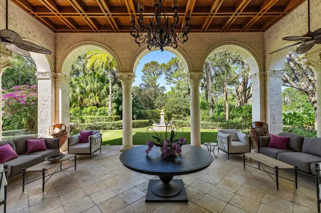 a spacious bathroom with a bathtub a sink and a large mirror