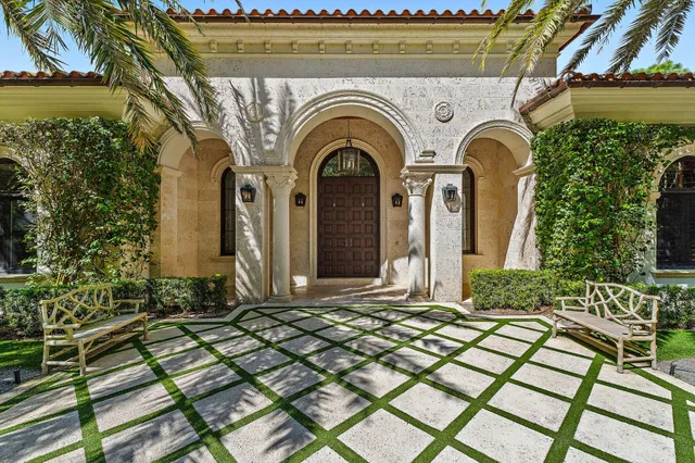 a kitchen that has a lot of cabinets a sink and wooden floor