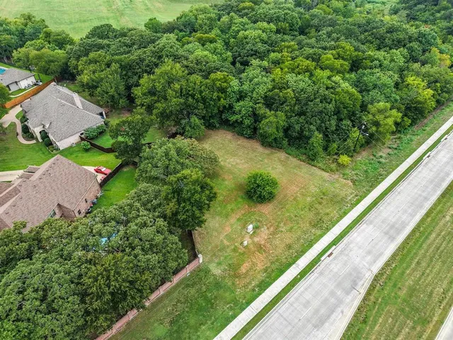 a view of a floor to ceiling window and a yard