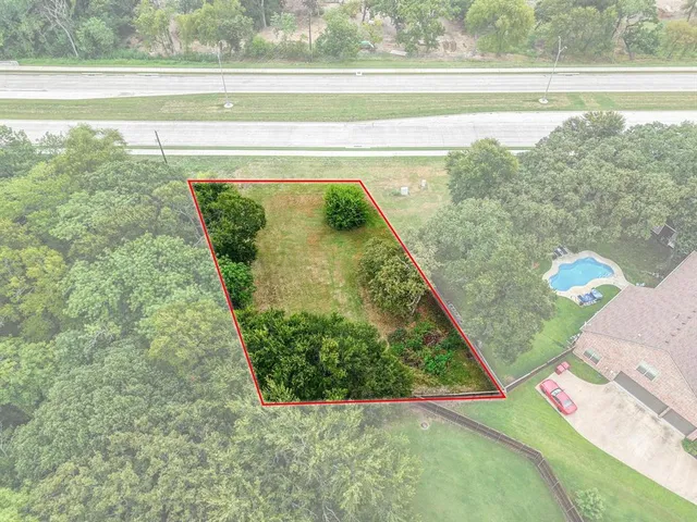 a view of a yard with an outdoor seating