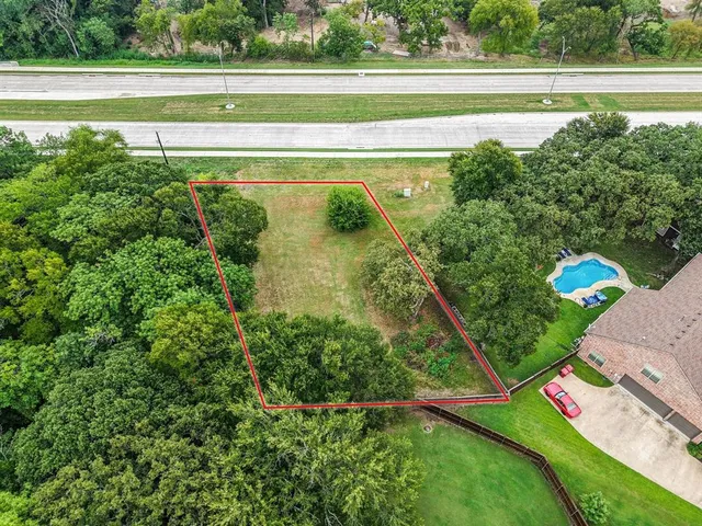 a view of a lake with a building in the background