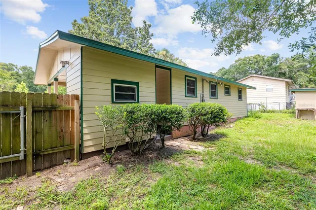 a view of backyard with a garden and plants