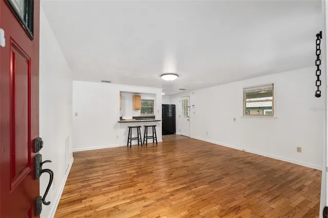 a view of a livingroom with chairs and workspace