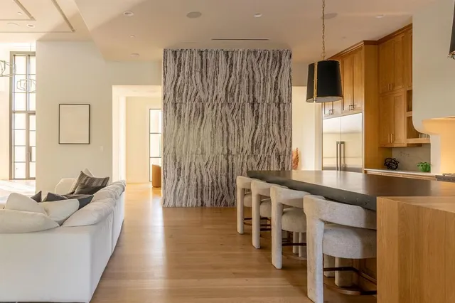 a living room with furniture window and wooden floor