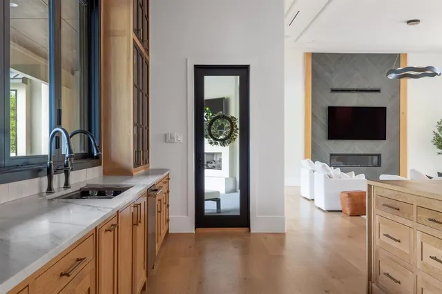 a kitchen with a sink stove and cabinets
