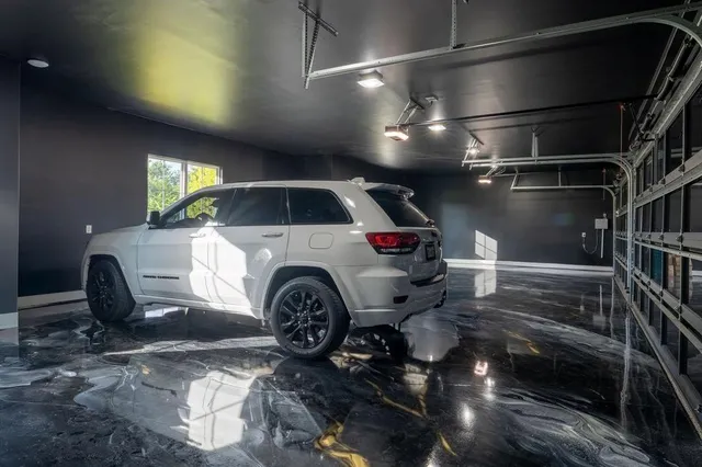 an aerial view of a house with ocean view