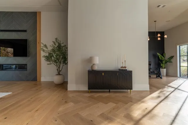 a bedroom with a bed and a potted plant
