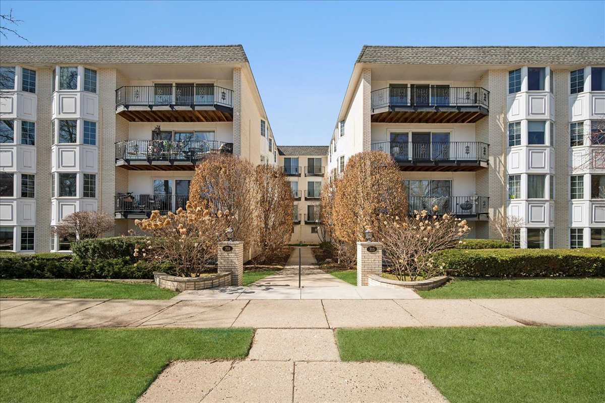 715 Ridge Road, Unit 1BN Wilmette, IL 60091 - Photo 1 of 15 a front view of building with yard