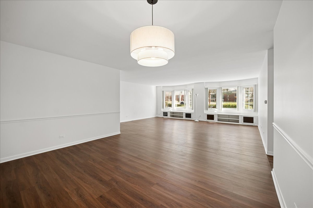 715 Ridge Road, Unit 1BN Wilmette, IL 60091 - Photo 3 of 15 a view of a livingroom with wooden floor