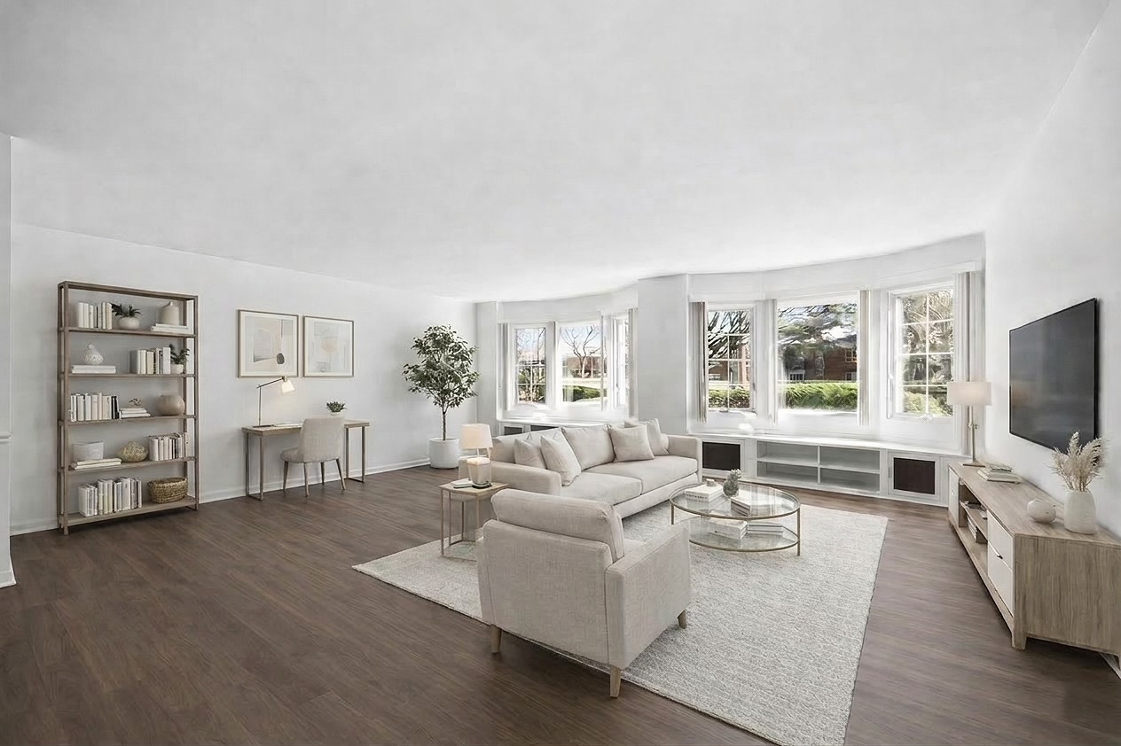 715 Ridge Road, Unit 1BN Wilmette, IL 60091 - Photo 7 of 15 a living room with furniture and a flat screen tv