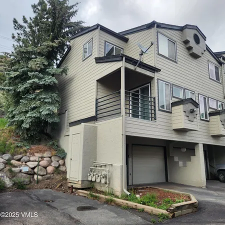 a front view of a house with parking