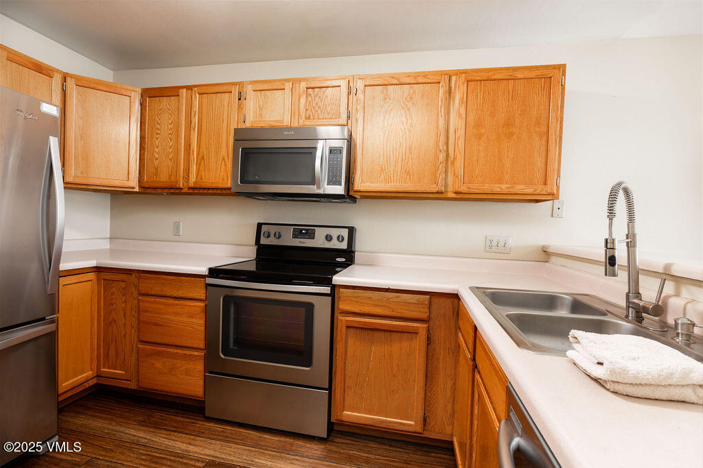 600 Nottingham Road, Unit 15 Avon, CO 81620 - Photo 5 of 10 a kitchen with a sink a stove and cabinets