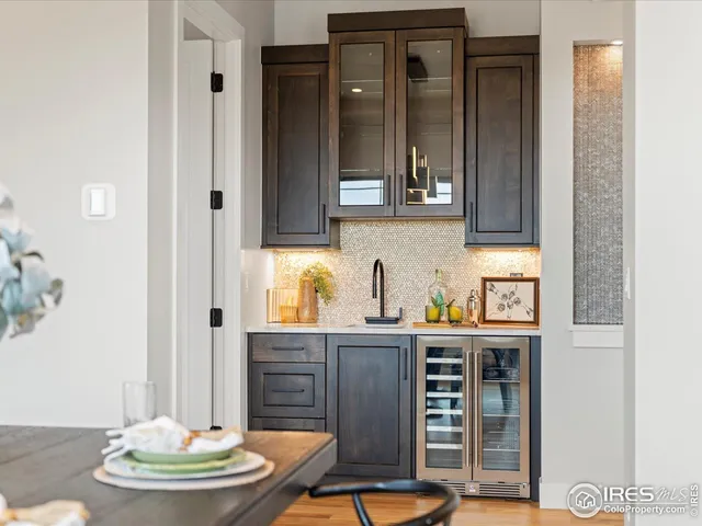a kitchen with stainless steel appliances granite countertop a sink and cabinets