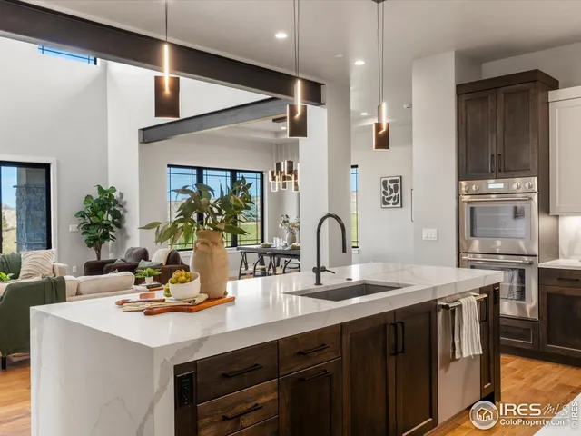 a kitchen with a sink refrigerator and cabinets