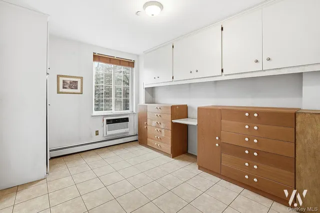 a kitchen with a cabinets and window