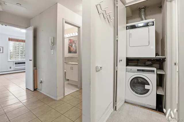 a utility room with closet dryer and washer