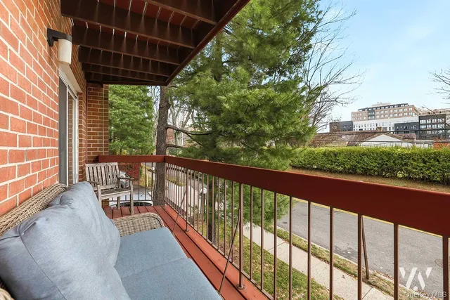 a view of balcony with furniture