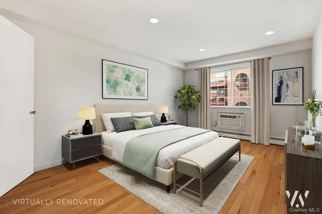 a bedroom with a large bed and a painting on the wall