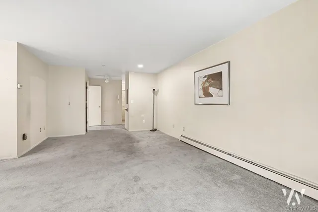 an empty room with a ceiling fan