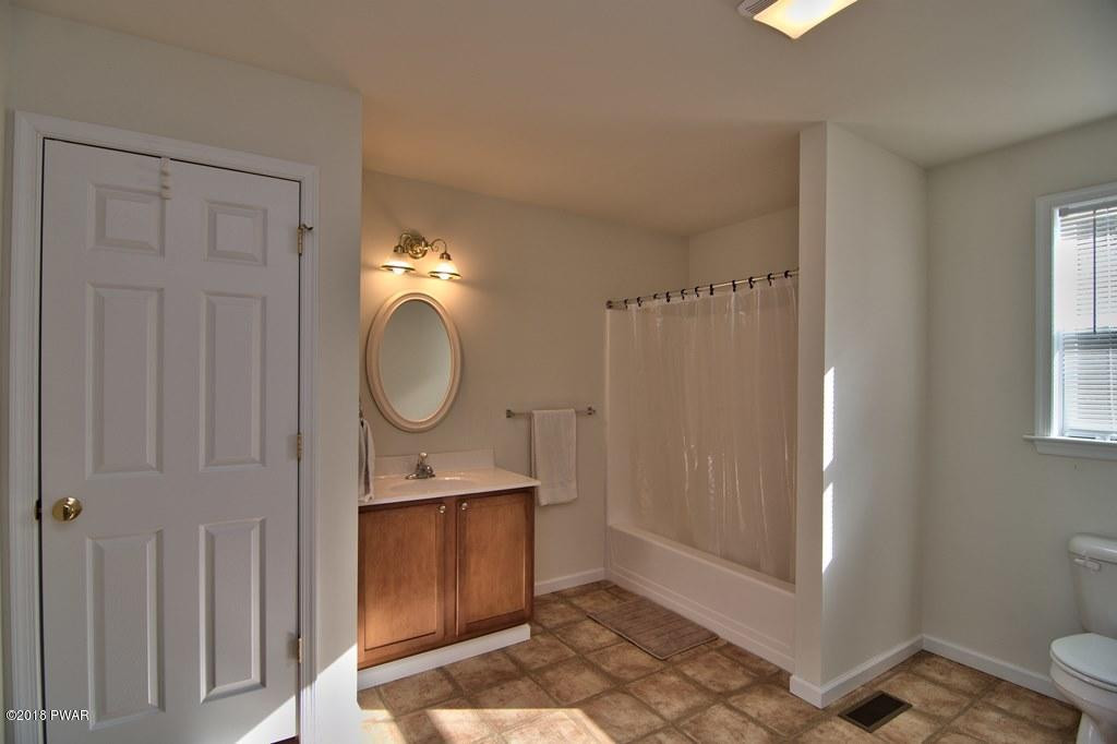 2312 Brookfield Road Lake Ariel, PA 18436 - Photo 7 of 26 a bathroom with a sink a toilet and shower
