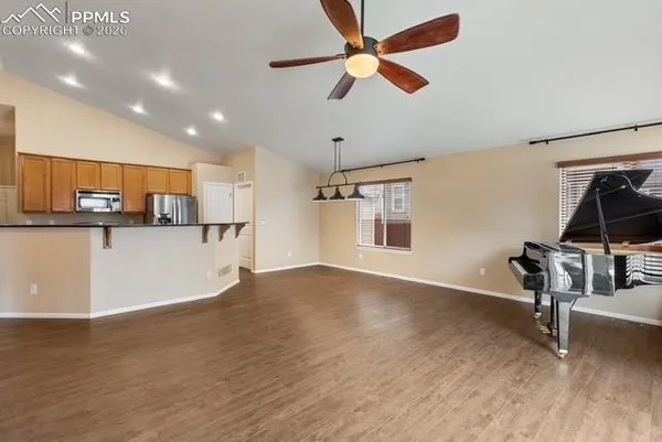 a view of a kitchen with workspace and a window