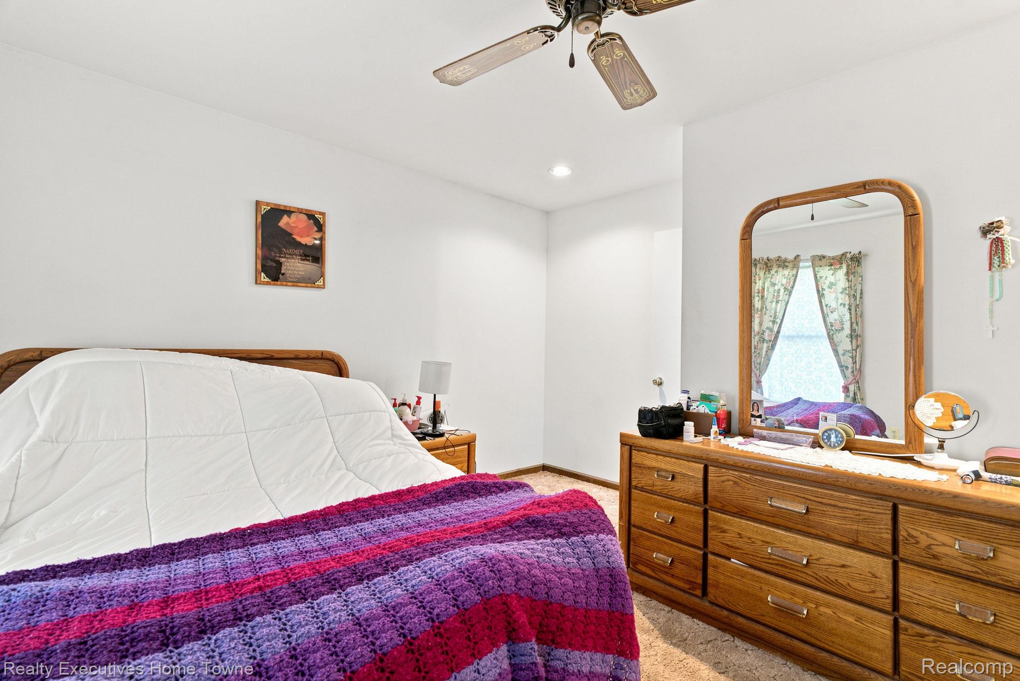 959 Braidwood Road Memphis, MI 48041 - Photo 31 of 58 Bedroom featuring neutral wall paint, carpet flooring, a ceiling fan with light fixture, and recessed lighting